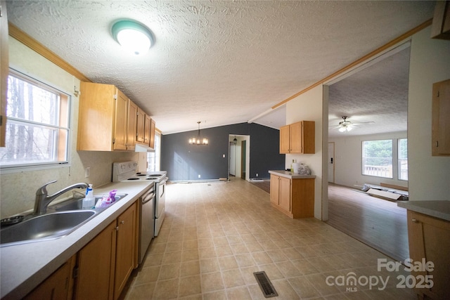 kitchen featuring pendant lighting, dishwasher, vaulted ceiling, sink, and white electric range oven