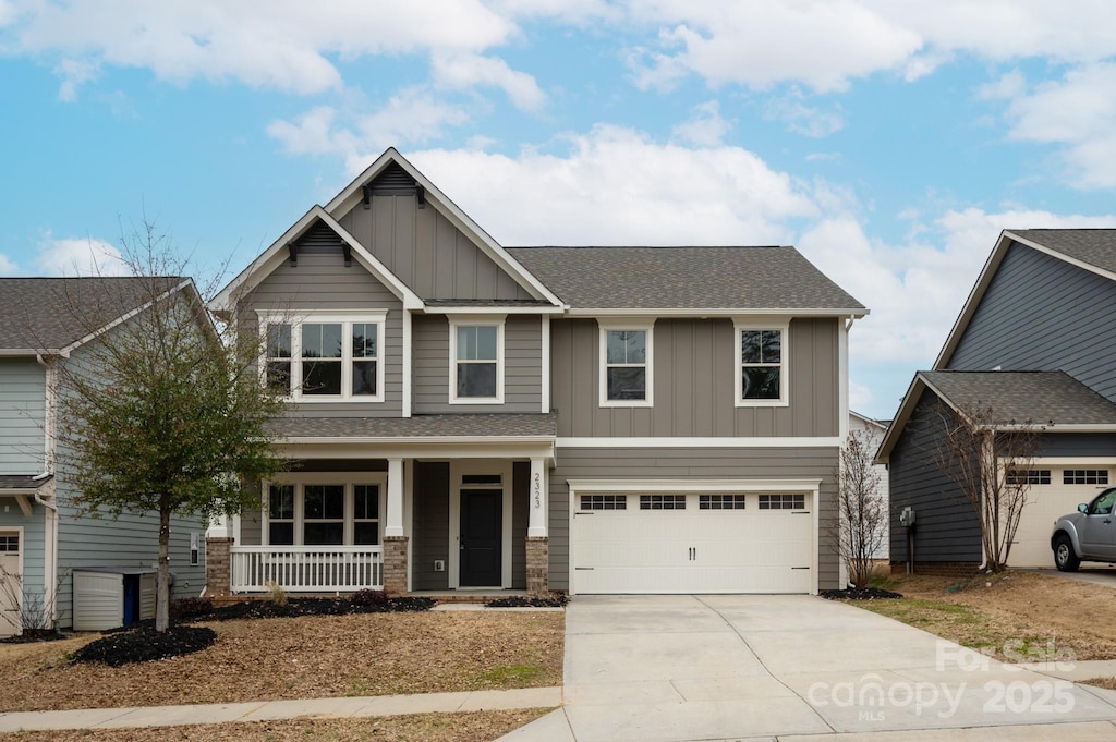 craftsman-style home featuring a garage and covered porch