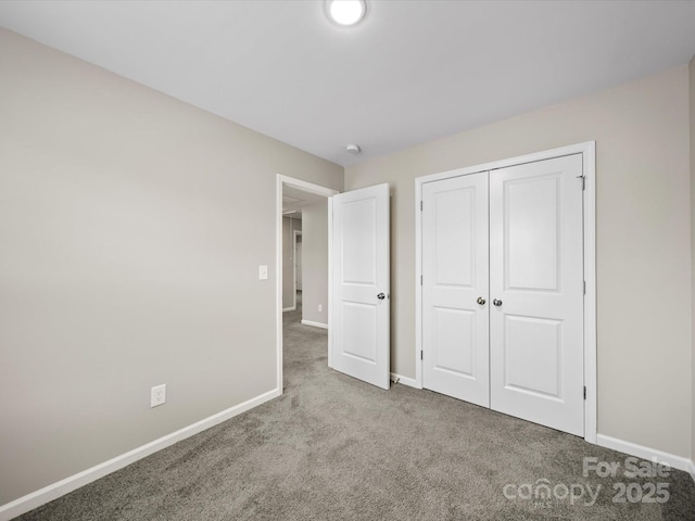 unfurnished bedroom featuring a closet and carpet