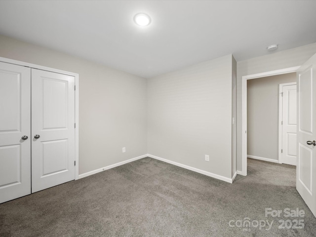 unfurnished bedroom with carpet and a closet