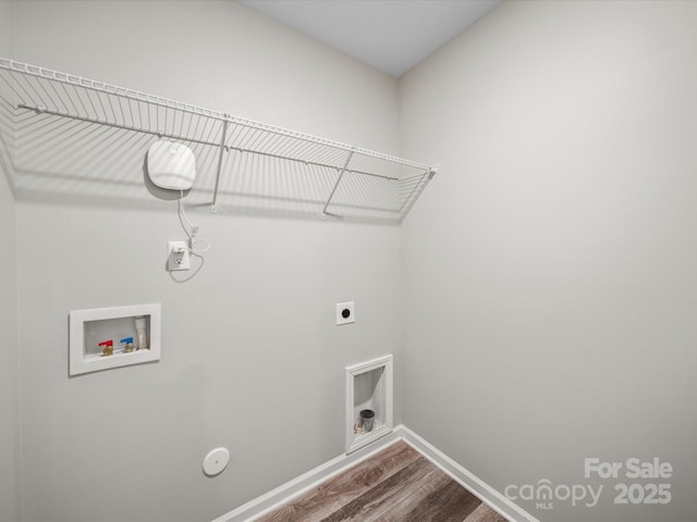 laundry area featuring hookup for a washing machine, hookup for an electric dryer, hardwood / wood-style floors, and hookup for a gas dryer