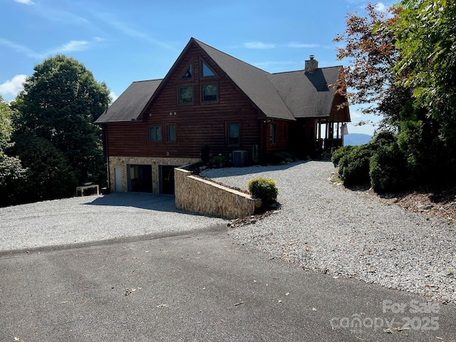 view of home's exterior featuring a carport and cooling unit