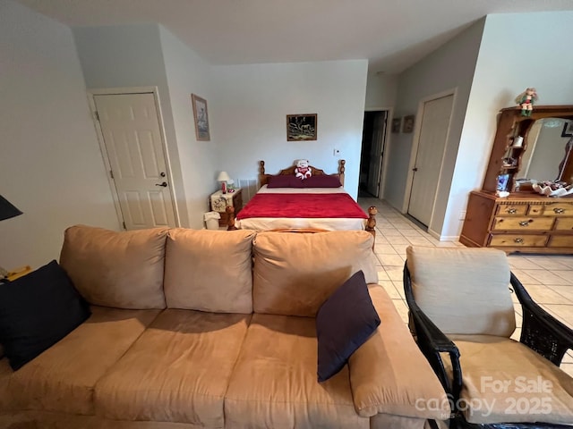 bedroom featuring light tile patterned flooring