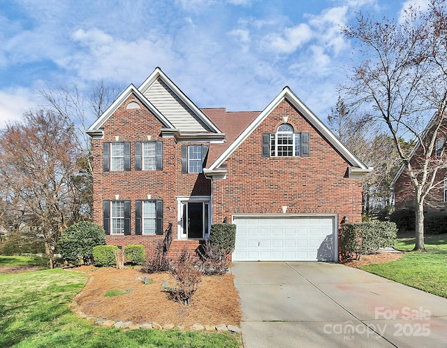 view of property featuring a garage and a front yard