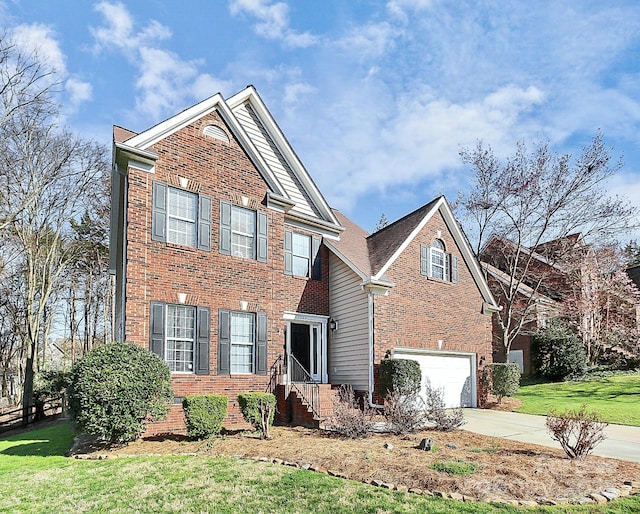 view of front of home with a garage and a front yard