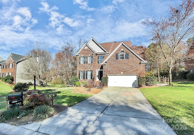 view of front of house with a garage and a front yard