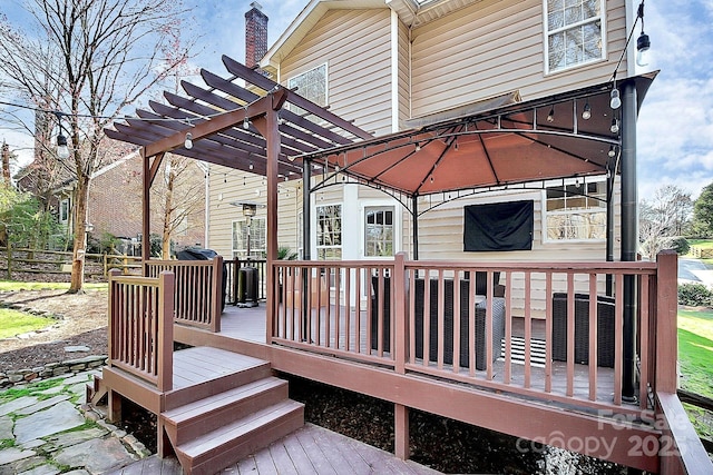 wooden terrace with a gazebo and a pergola