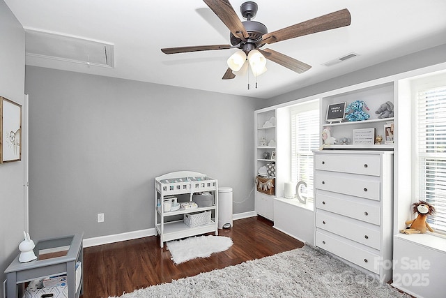 bedroom with ceiling fan and dark hardwood / wood-style flooring