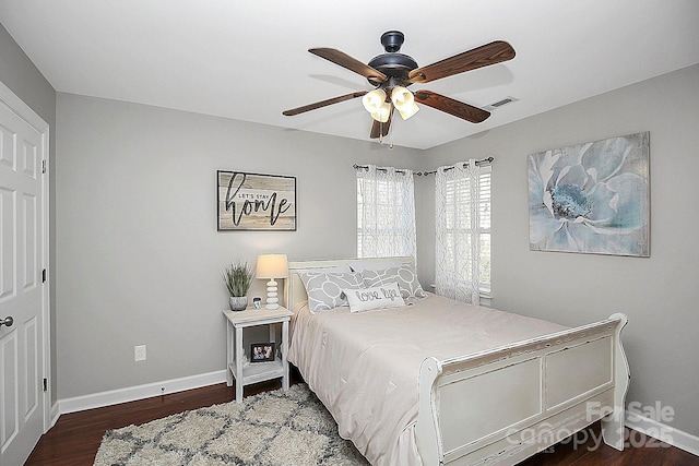 bedroom with ceiling fan and dark hardwood / wood-style flooring