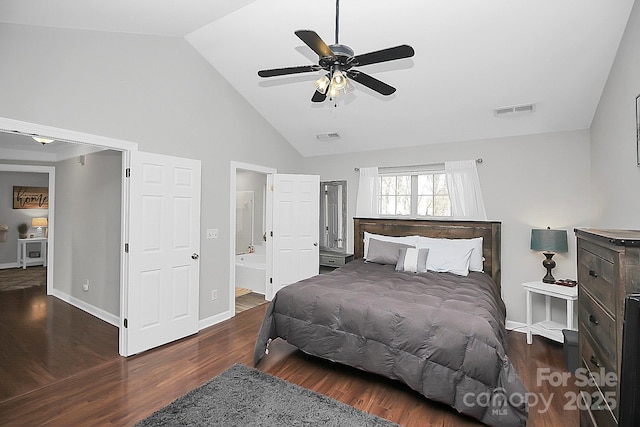 bedroom with high vaulted ceiling, dark hardwood / wood-style floors, ceiling fan, and ensuite bath