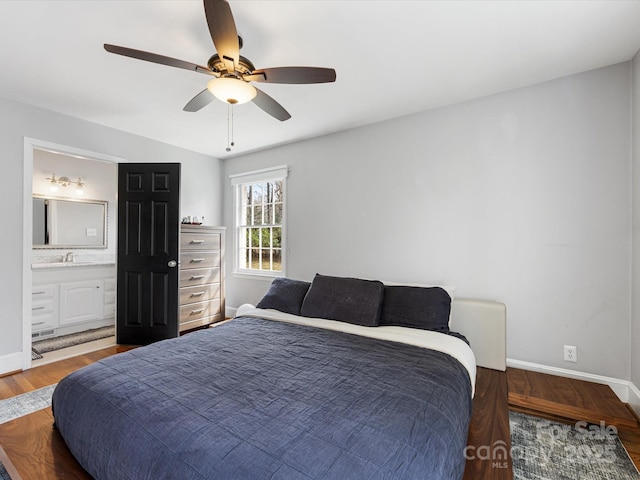 bedroom with a ceiling fan, baseboards, and wood finished floors