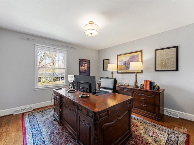 office space featuring dark wood-style floors, visible vents, and baseboards