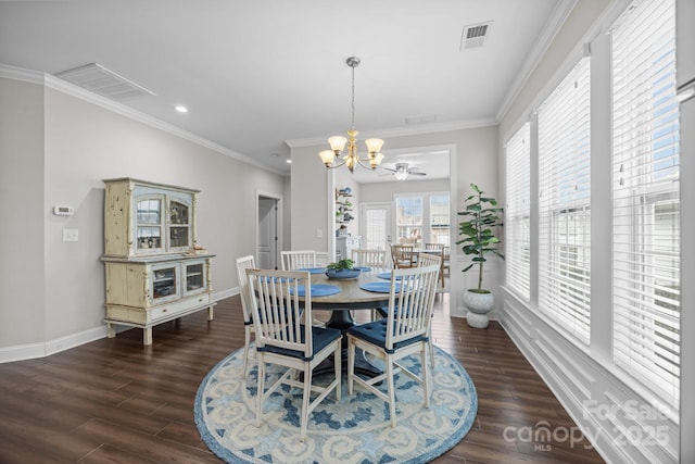 dining area featuring visible vents, baseboards, dark wood-style floors, crown molding, and a chandelier