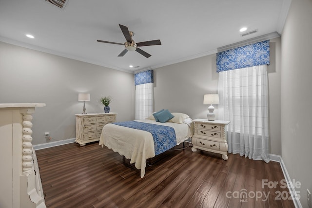 bedroom with ornamental molding, dark wood-style flooring, visible vents, and baseboards