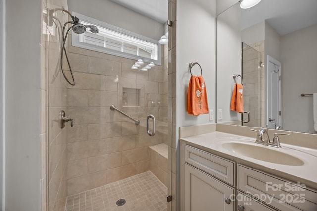 full bath featuring a stall shower and vanity