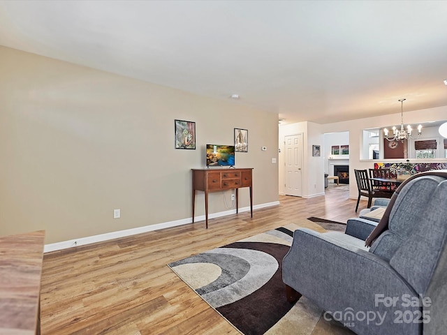 living room featuring hardwood / wood-style flooring and a chandelier