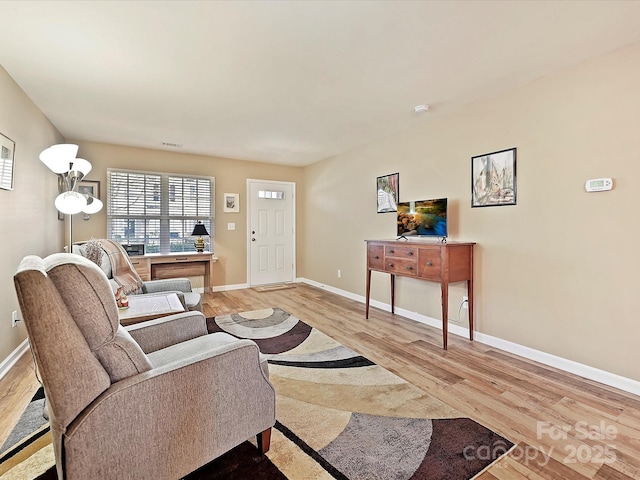 living room with light hardwood / wood-style floors