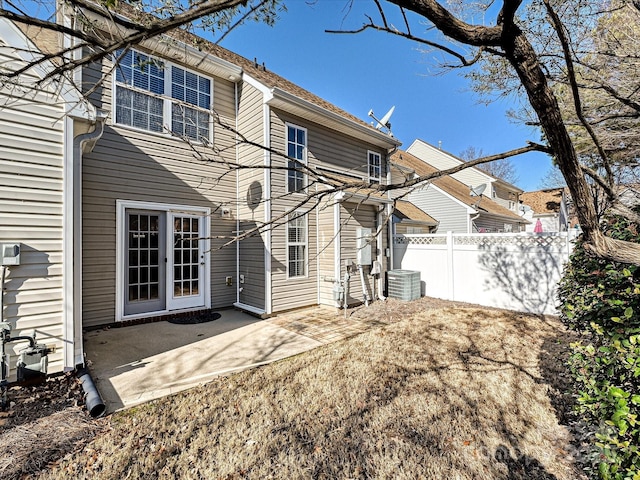 back of house featuring central AC unit and a patio area