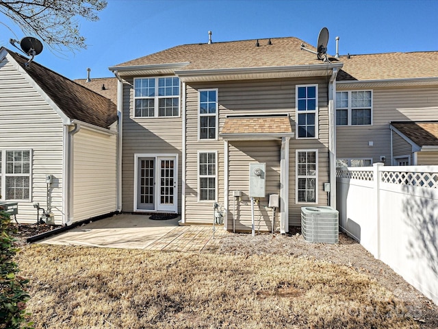 rear view of house featuring central AC and a patio