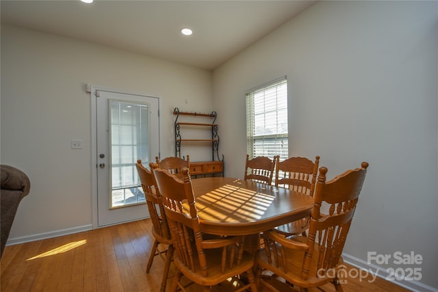 dining space with baseboards, recessed lighting, and light wood-style floors