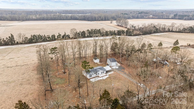 birds eye view of property with a rural view