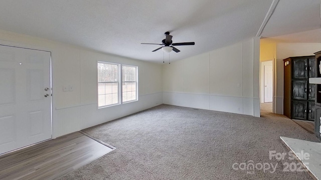 interior space featuring a textured ceiling and ceiling fan