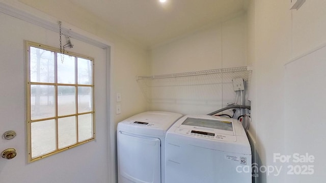 laundry area with washing machine and clothes dryer