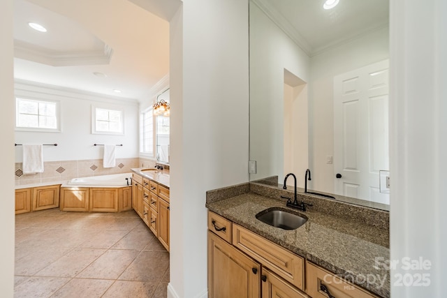 bathroom with a bathtub, crown molding, and a wealth of natural light