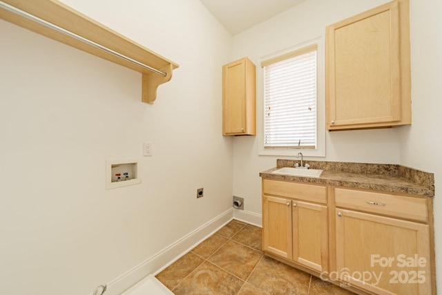 washroom with sink, light tile patterned floors, electric dryer hookup, hookup for a washing machine, and cabinets