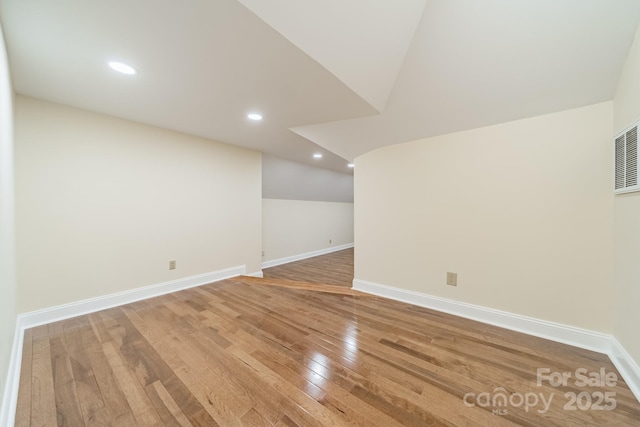 basement featuring hardwood / wood-style floors