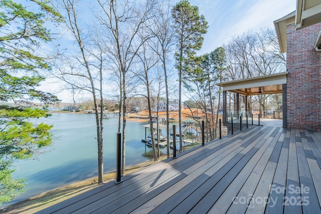 wooden terrace with a boat dock and a water view