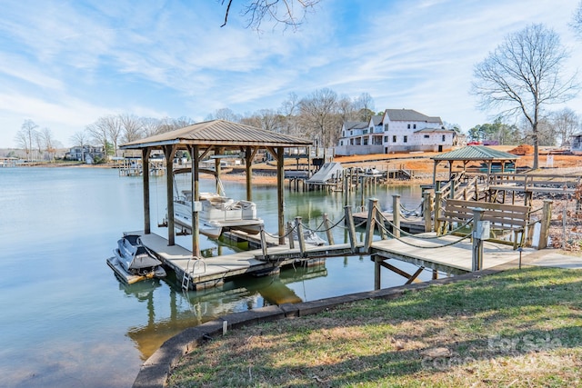 view of dock with a gazebo and a water view