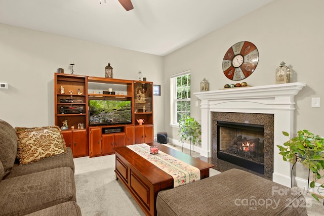 carpeted living room featuring ceiling fan