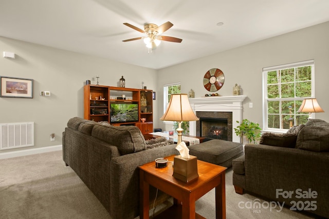 living room with light carpet and ceiling fan