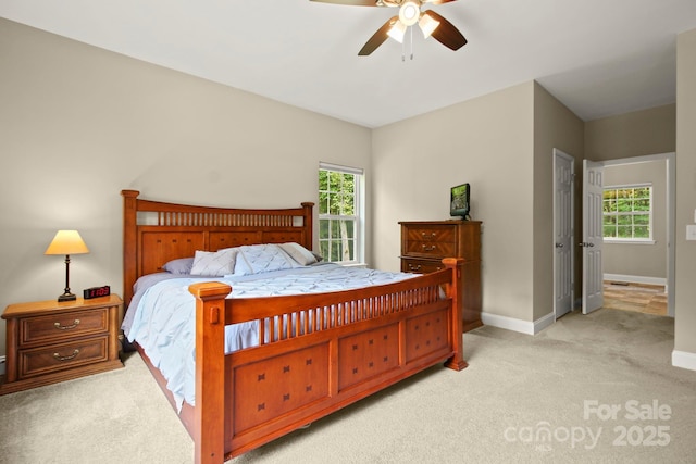 bedroom with light carpet and ceiling fan