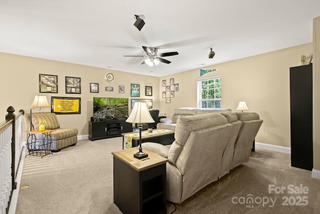 living room with light colored carpet and ceiling fan