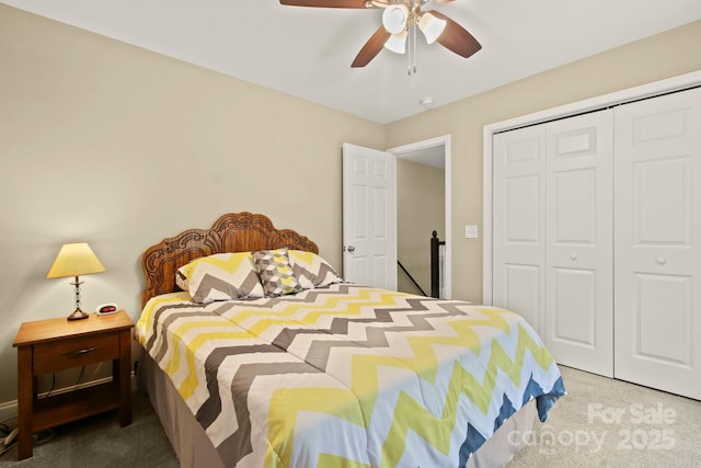 carpeted bedroom with a closet and ceiling fan