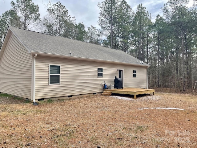 rear view of house featuring a deck