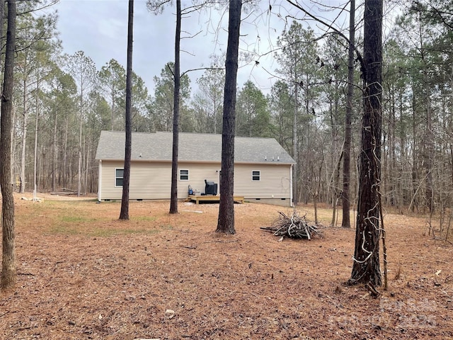 view of property exterior featuring a deck