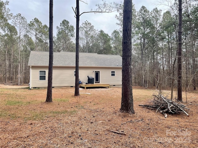 view of side of home featuring a deck