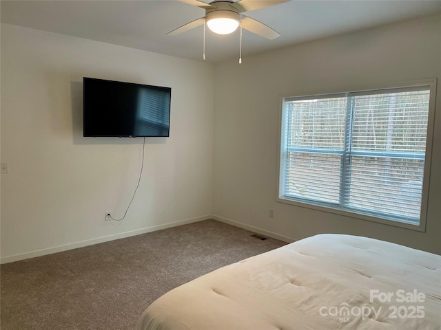 unfurnished bedroom featuring carpet flooring and ceiling fan