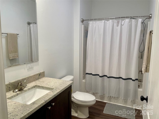 full bathroom featuring vanity, wood-type flooring, shower / bath combination with curtain, and toilet