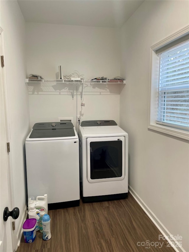 washroom featuring separate washer and dryer and dark hardwood / wood-style flooring