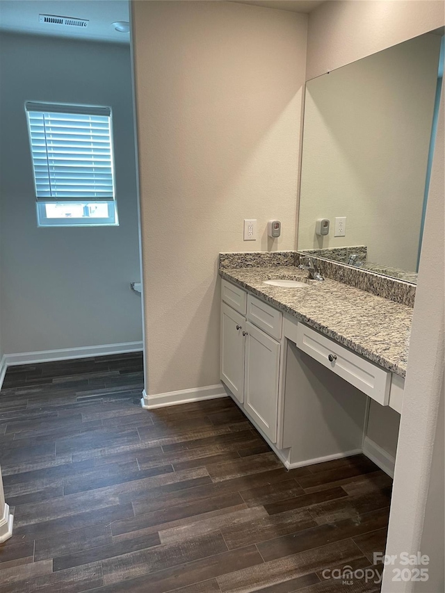 bathroom with wood-type flooring and vanity