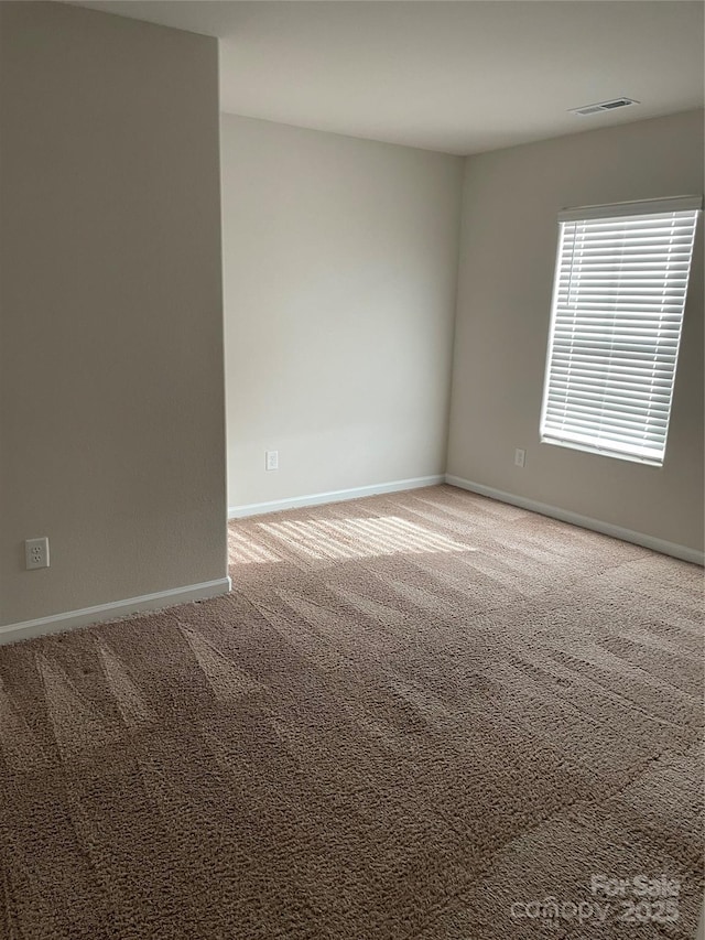 view of carpeted spare room