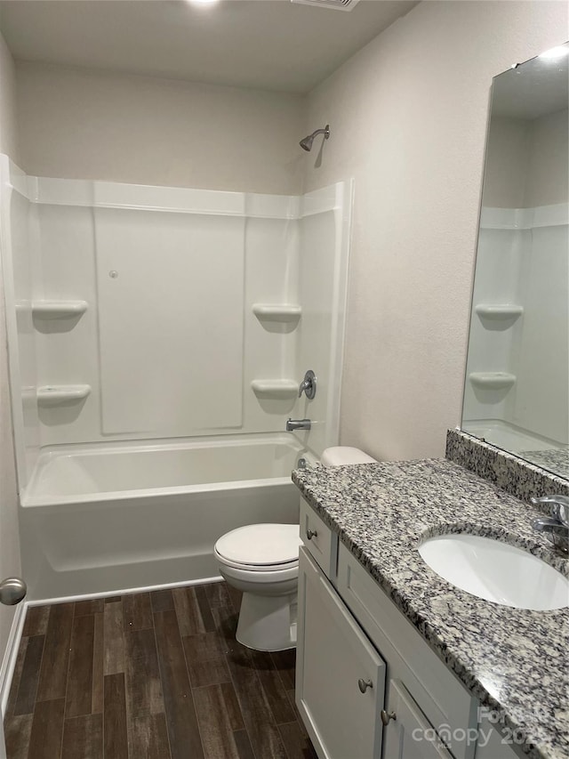 full bathroom with toilet, shower / bathing tub combination, and vanity