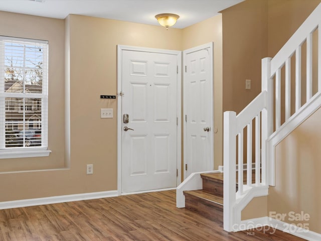 foyer entrance with hardwood / wood-style floors