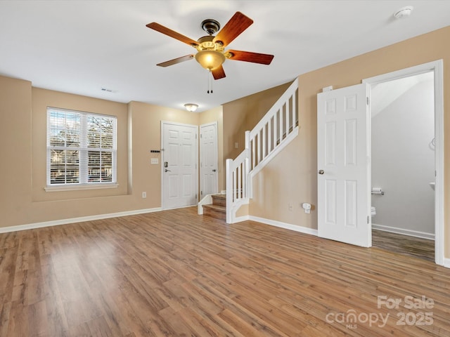 entryway featuring ceiling fan and wood-type flooring