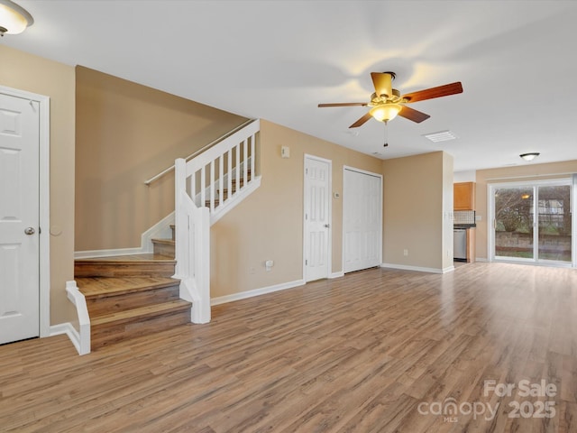 unfurnished living room with ceiling fan and light hardwood / wood-style floors