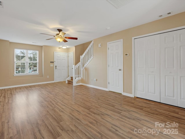 interior space featuring ceiling fan and light wood-type flooring